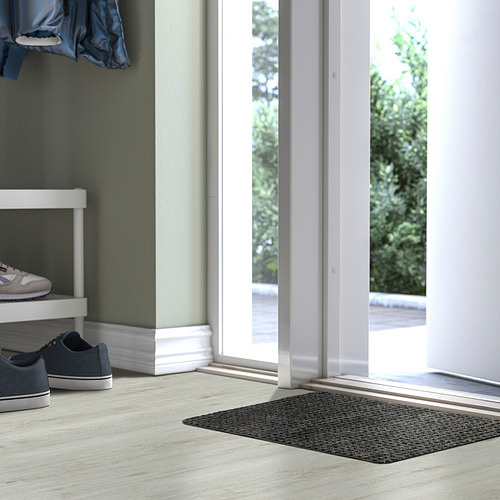 Felpudo FRIKTION gris cerca de puerta de cristal, a cuadros, poliéster.