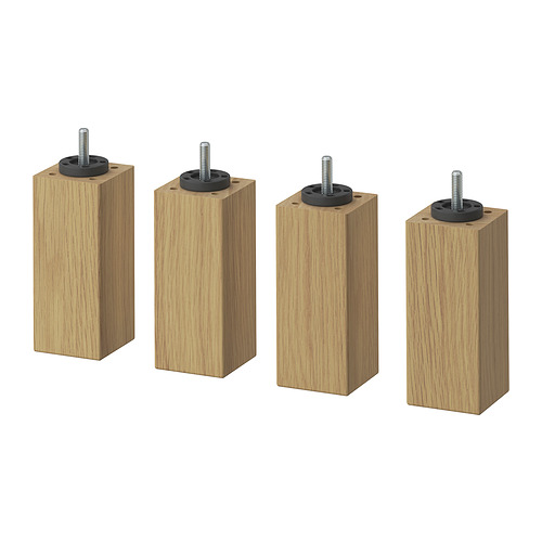 Cuatro patas de madera con fijaciones de metal negro, dispuestas en línea. Simple, marrón claro con grano visible, diseño cuadrado.