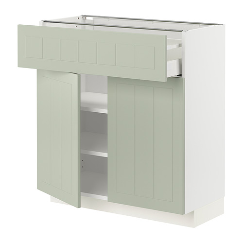 Mueble de cocina moderno, de color verde pálido, rectangular, con un cajón y dos puertas. Hecho de tableros de fibra y tableros de partículas.