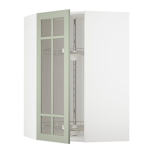 Un gabinete de cocina con puerta de vidrio verde claro del sistema METOD de ikea, con un diseño elegante con estantes ajustables.