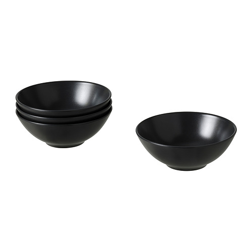 Cuencos de cerámica negra, apilables, acabado mate, forma redonda, diseño sencillo.