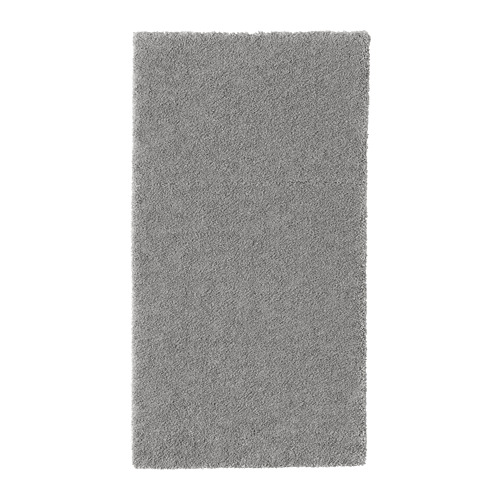 Alfombra STOENSE rectangular gris con pelo suave y grueso para mayor comodidad y amortiguación del sonido.