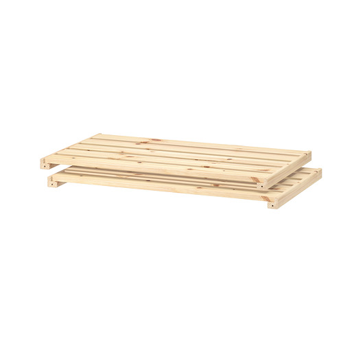 Una estantería de madera HEJNE, de color natural, fabricada en pino macizo, de forma rectangular y diseño sencillo.