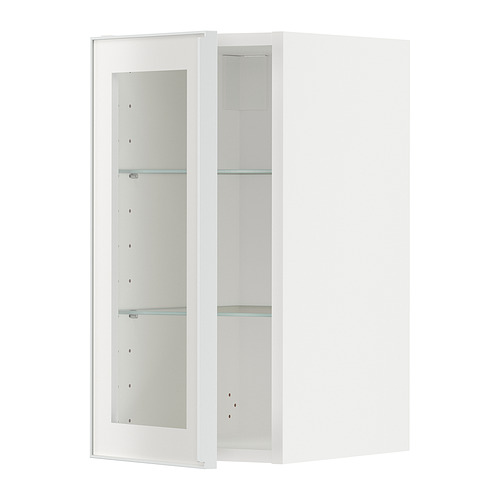 Mueble de cocina METOD blanco con puerta de cristal y marco metálico.