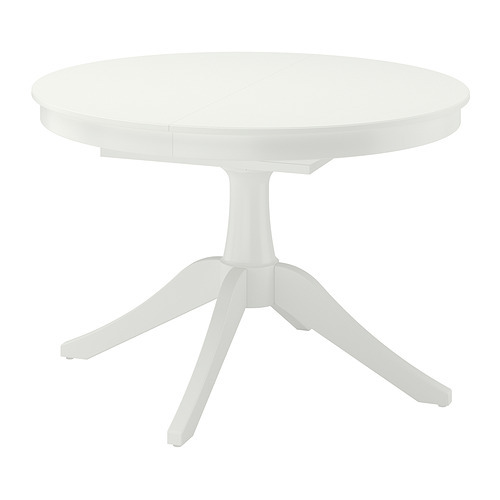 Una mesa de comedor redonda ROSENTORP blanca con cuatro patas, diseñada para una fácil extensión.