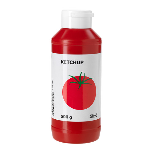 Botella de KETCHUP. Envase de plástico rojo con etiqueta blanca, gráfico de tomate. Condimento popular para diversos platos.