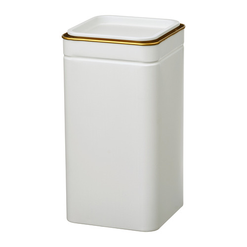 Una lata rectangular blanca BLOMNING con ribetes dorados. Es simple y elegante, perfecto para el almacenamiento.