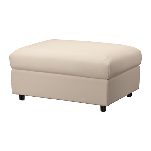 Un reposapiés VIMLE beige con almacenaje, de forma rectangular y robustas patas de madera.