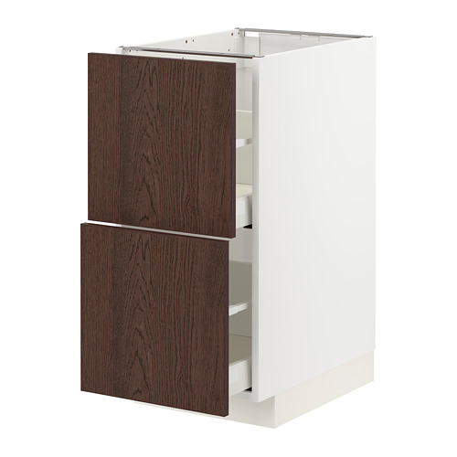 Cajón de madera marrón oscuro en armario blanco.