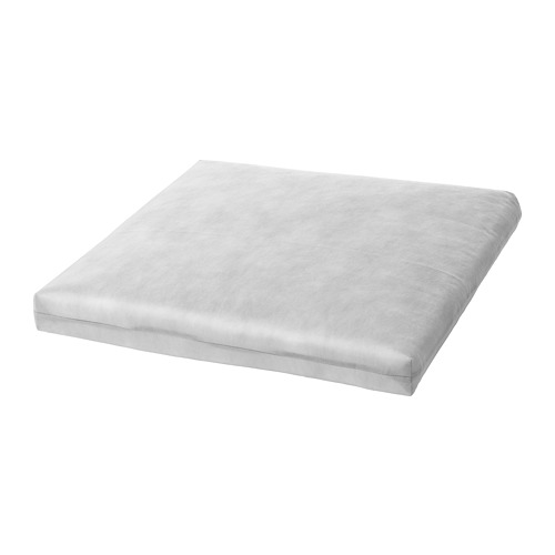 Cojín rectangular blanco con tela suave y texturizada para mayor comodidad al sentarse al aire libre.