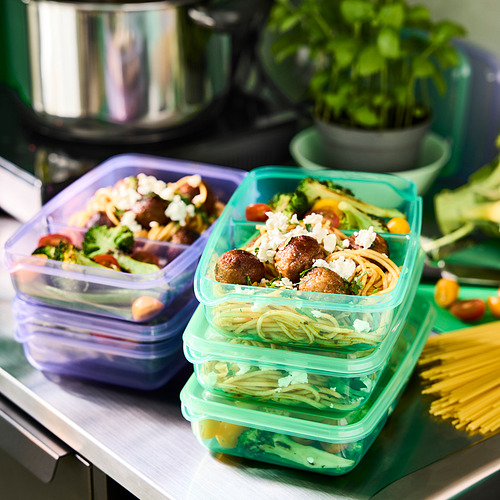 Recipientes de comida coloridos y apilables con compartimentos para sándwiches y acompañamientos, ideales para empacar comidas para niños.