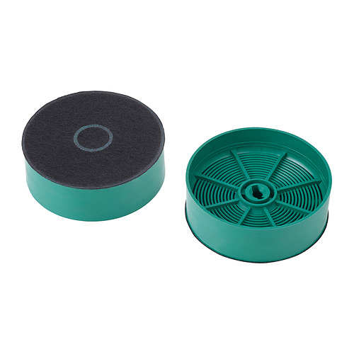 Dos filtros redondos de carbón verde, uno con carbón negro expuesto en la parte superior, diseñados para recircular los olores de la cocción.