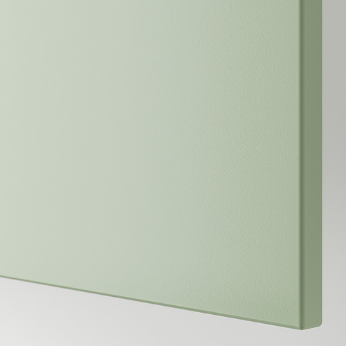 Primer plano del panel de cubierta liso, verde, lacado, parte de la colección STENSUND. Muestra un acabado elegante y resistente a las manchas.