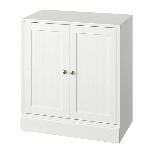 Un mueble HAVSTA en blanco con detalles en madera, forma rectangular y un diseño sencillo adecuado para diversas decoraciones.