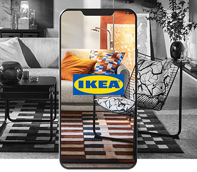 Smartphone screen displaying the IKEA logo and revealing a full-color room.