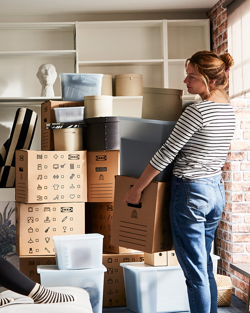 A women lifting some boxes