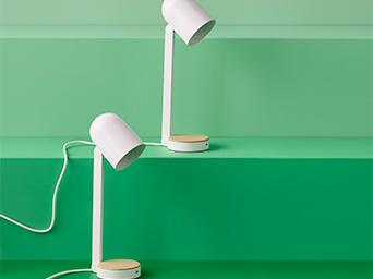 White IKEA table lamps with wooden bases. Functional lighting and modern style for any surface.