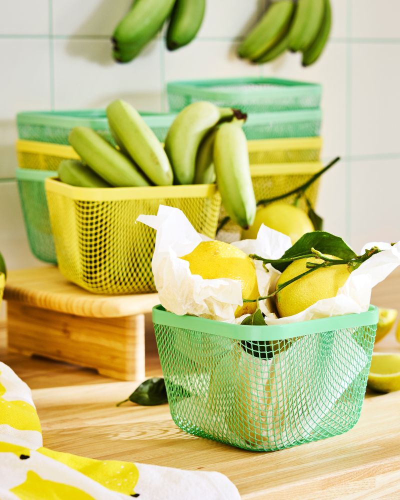 Lemons and bananas stored in green and  yellow mesh IKEA 365+food storage baskets.