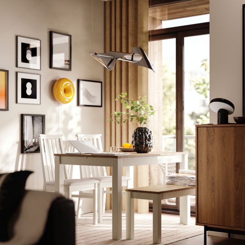 A dining area has a beige/brown ÅLHULT extendable table with a bench on one side and two chairs with soft seats on the other.