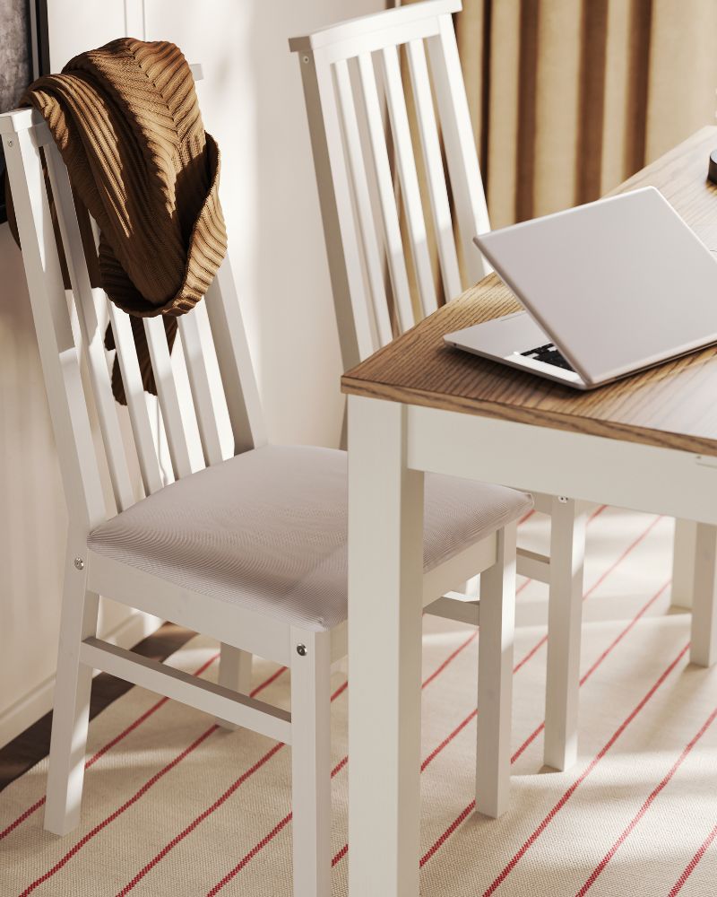 Two ÅLHULT chairs in beige with soft seats in Kabusa light beige are placed next to an beige/brown ÅLHULT extendable table