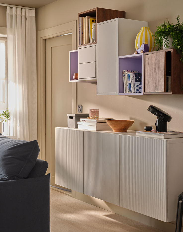 A modular living room set with decorative accents and details in light tones. 