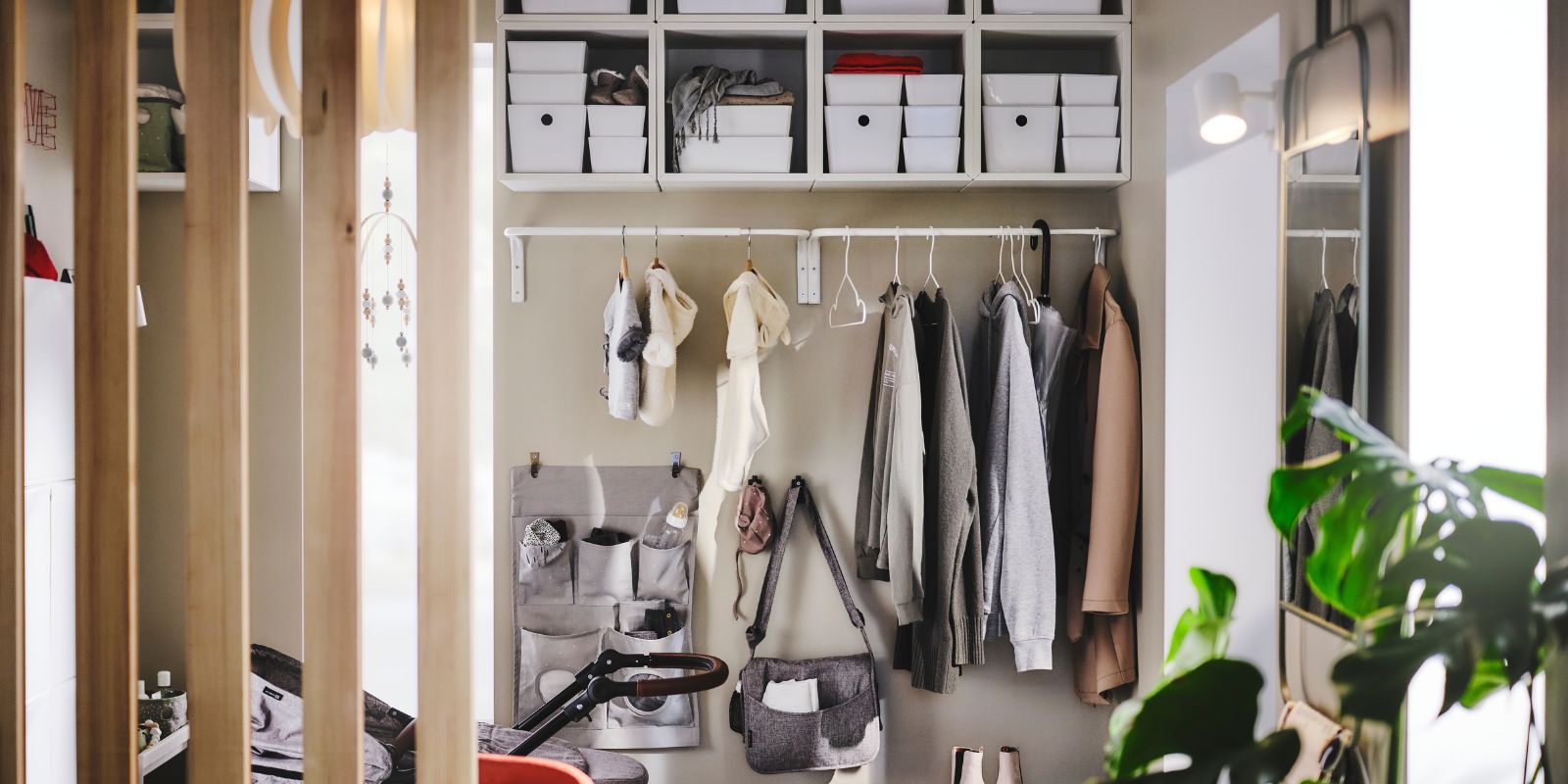 Tidy hallway with organized shelves featuring KUGGIS boxes, EKET wall shelf and LEN hanging storage.
