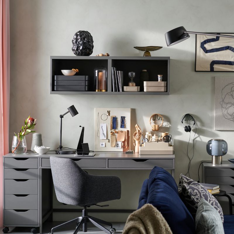 Home office with desk, comfortable chair and storage space