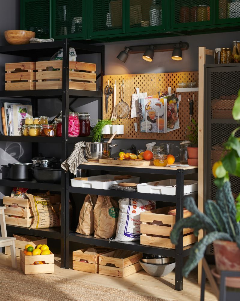 Functional pantry with BROR shelves, KNAGGLIG crates and SKÅDIS tools, featuring an organized kitchen with KORKEN jars.