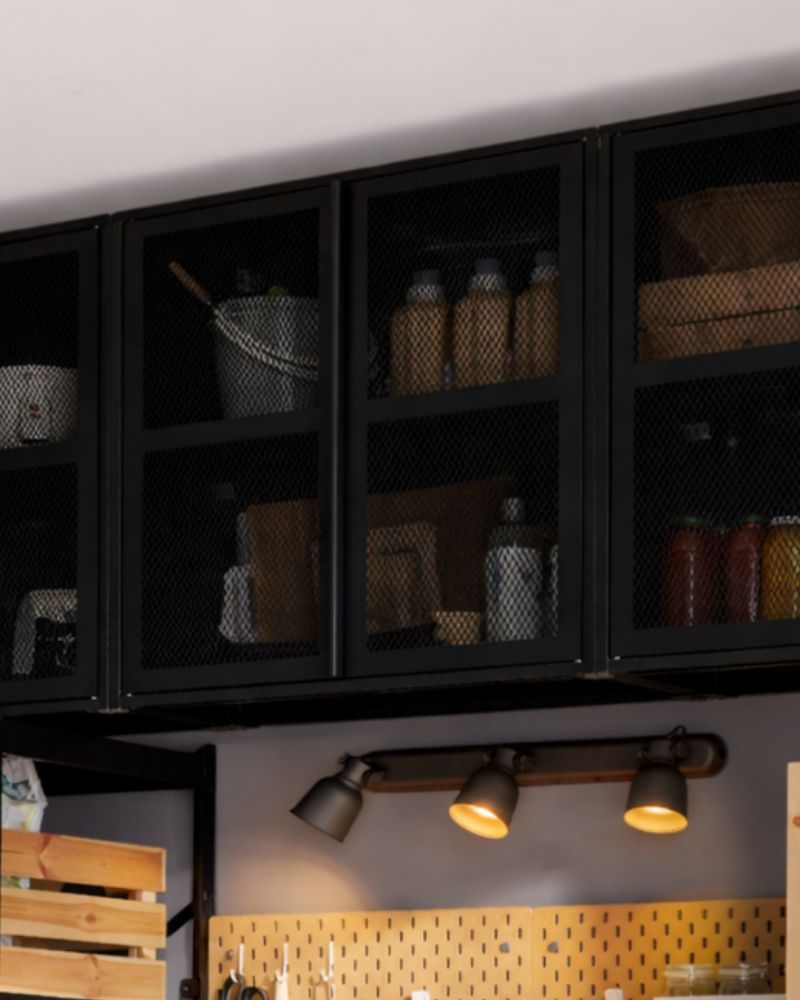 IVAR cabinet and BROR shelves with KNAGGLIG crates and KORKEN jars, plus SKÅDIS hooks for a practical storage setup.