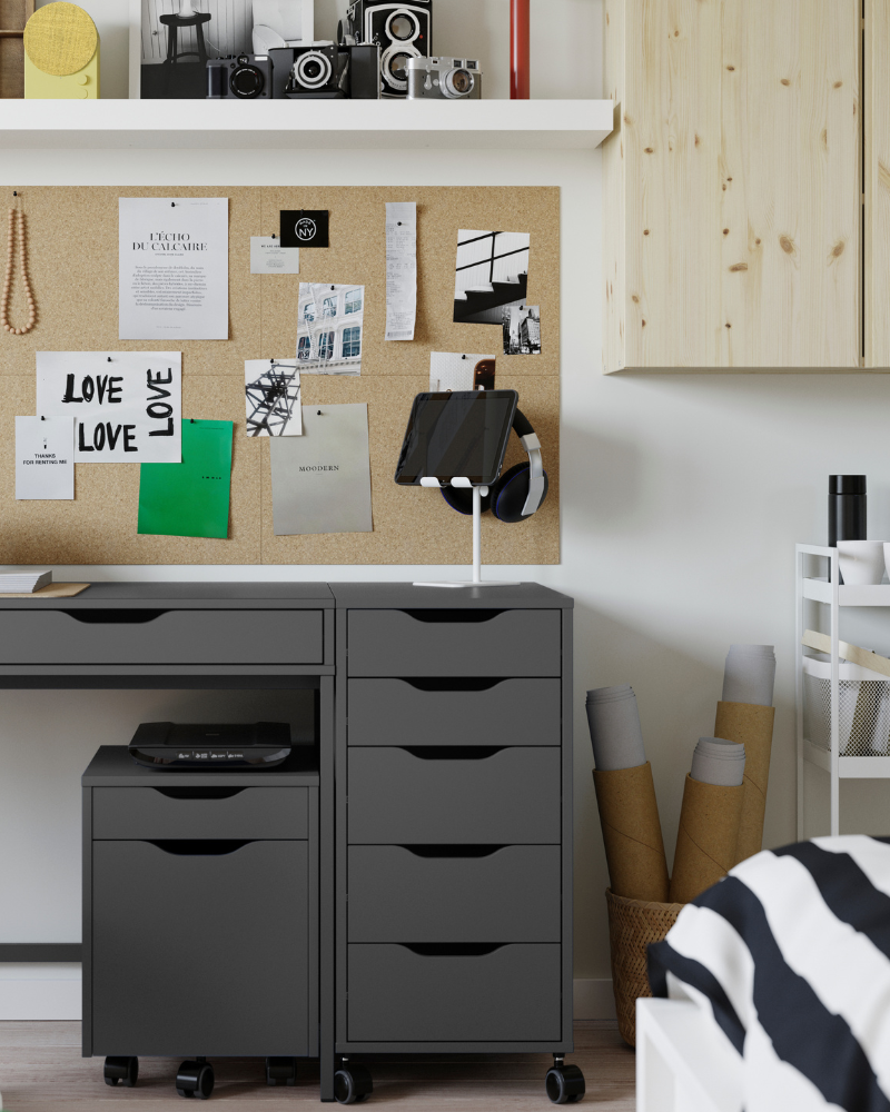 A study space with the ALEX desk and drawers, IVAR cabinet and FLÖNSA board, featuring HAVREHOJ stand and RISATORP baskets.