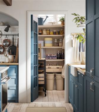 Kitchen pantry with wooden shelves filled with jars, food items, and organized containers.