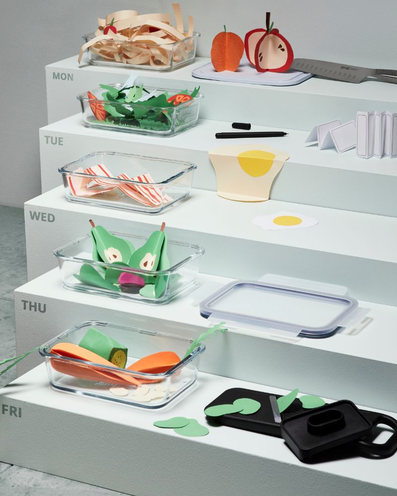 Organized kitchen prep with IKEA 365+ containers, vegetable knife and mandoline neatly storing sliced produce by day.