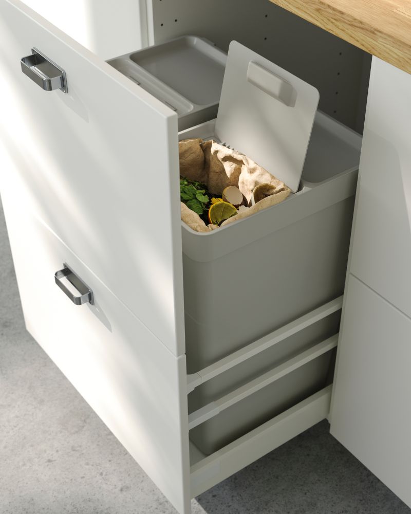 Compact recycling solution with HÅLLBAR waste containers inside a SEKTION/MAXIMERA base cabinet with smooth pull-out drawers.
