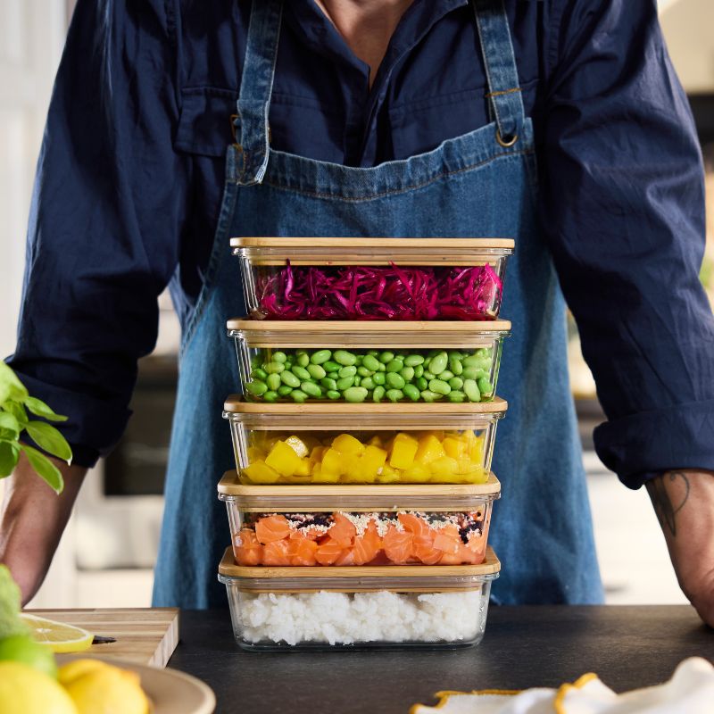 Bright kitchen prep with IKEA 365+ food containers with lids, clear stacked boxes showcasing colorful chopped vegetables.