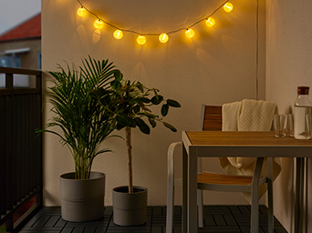 SOLVINDEN LED lamps with large NYPON plant pots.