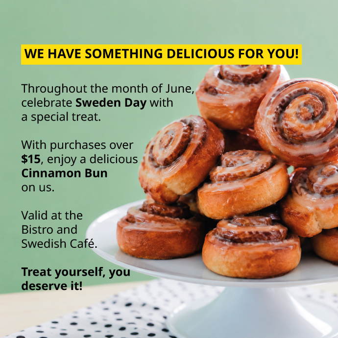 Stack of frosted cinnamon buns on white stand, June promotion.
