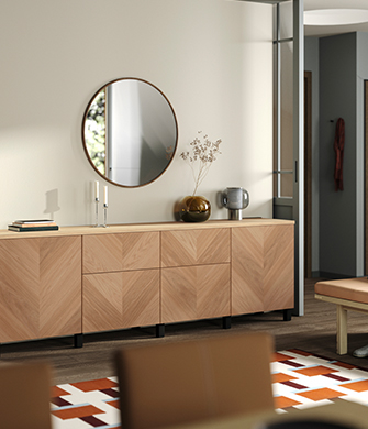 Horizontal cabinet with legs and wooden doors, topped by a round mirror