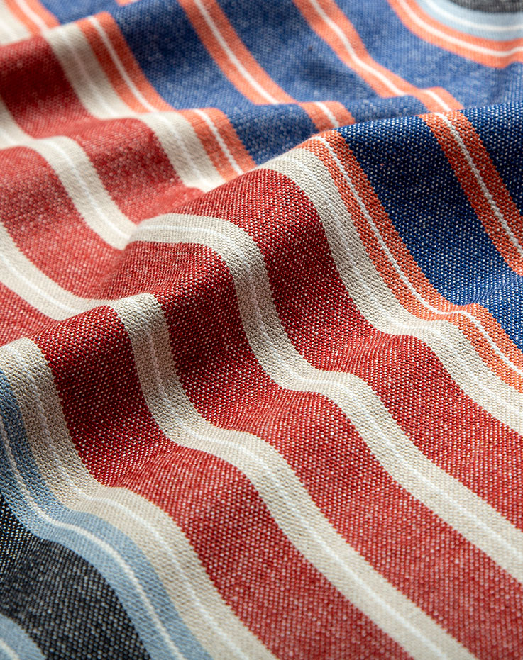 A close-up of the KORALLBUSKE pre-cut fabric in red, blue and white. Made of 50% recycled cotton.
